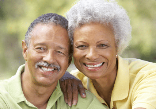 An elderly man and woman smiling