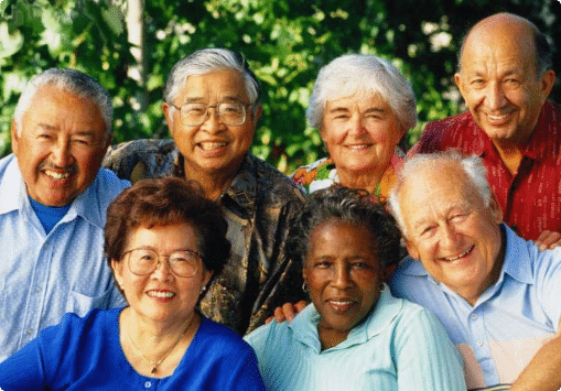 A multicultural group of seniors smiling