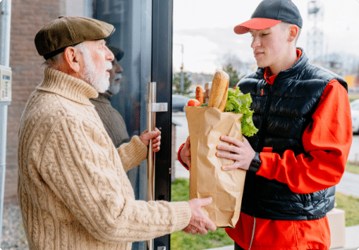 Elderly man getting groceries delivered