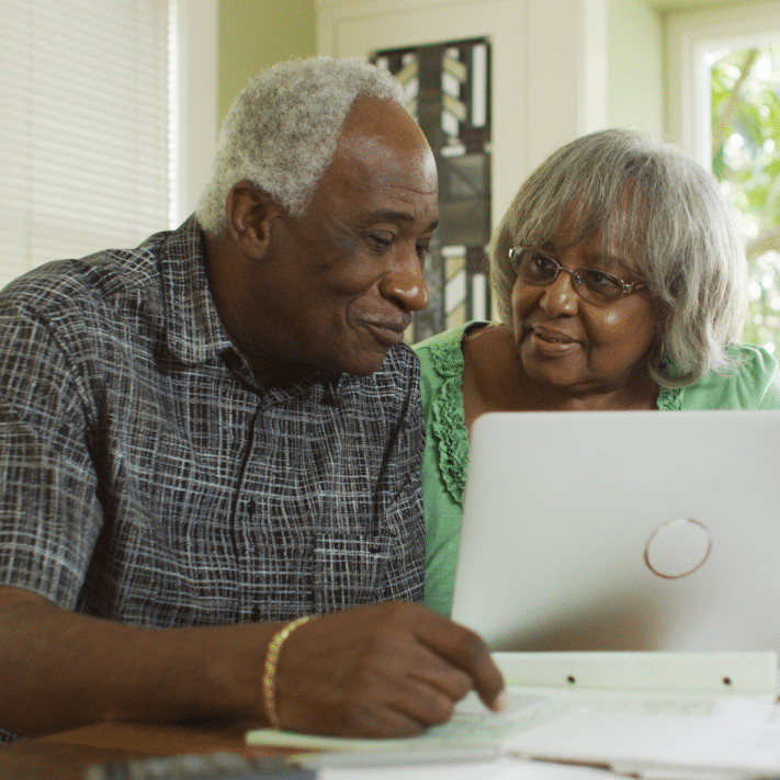 Couple looking at their computer together